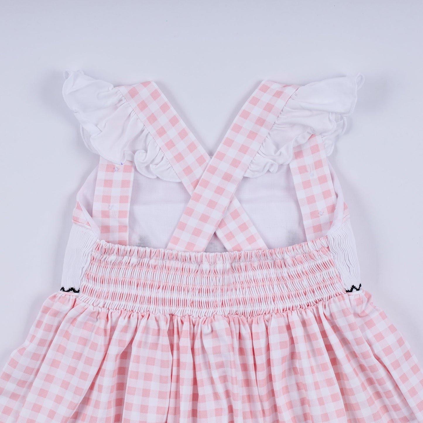 Pink character hand smocked gingham ruffle dress