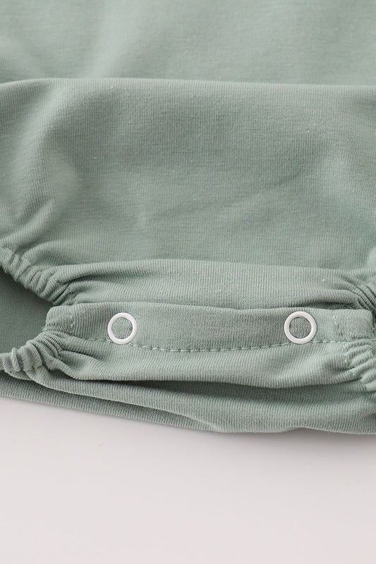 Green character applique bubble